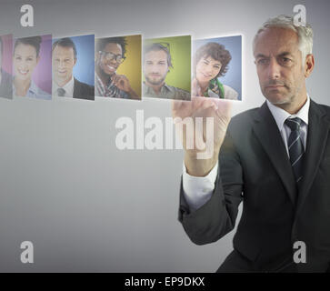 Serious human resources director selecting future employees Stock Photo