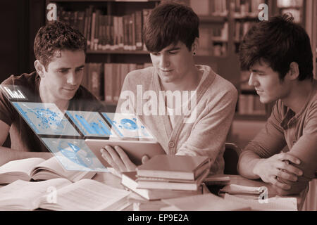 Focused students working on their digital tablet Stock Photo