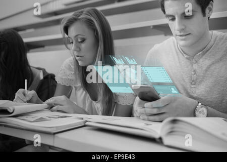 Focused college student working on futuristic smartphone Stock Photo