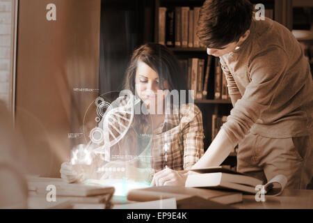 Focused college students analysing dna on digital interface Stock Photo