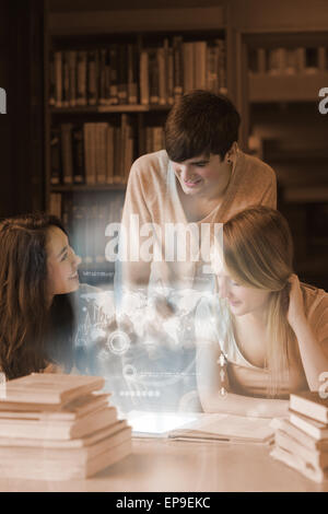 Happy students working together on international trade with futuristic interface Stock Photo