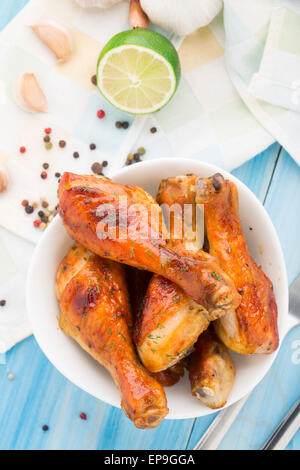 Delicious roasted chicken legs in a bowl Stock Photo