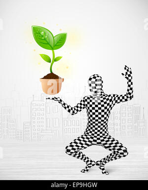 man in full body suit with eco plant Stock Photo