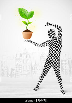 man in full body suit with eco plant Stock Photo