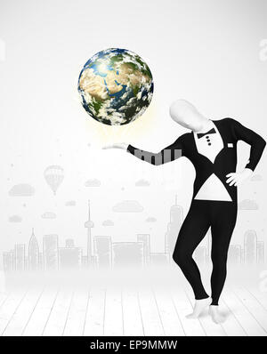 man in full body suit holding planet earth Stock Photo