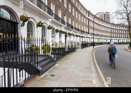 Georgian townhouses. A crescent of terraced houses at Cartwright Gardens, Bloomsbury, London, England, UK Stock Photo