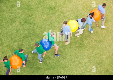 performing fitness ball team building activity Stock Photo