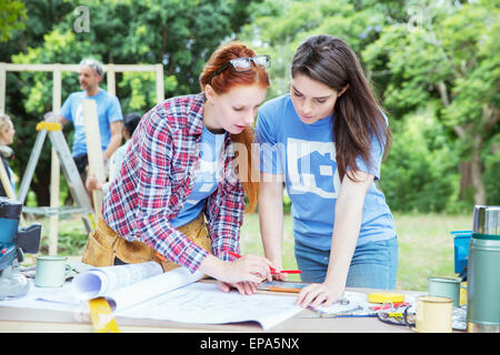 volunteering blueprint construction site Stock Photo