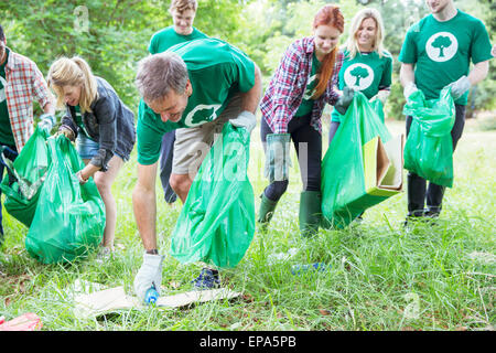 volunteering picking up trash Stock Photo