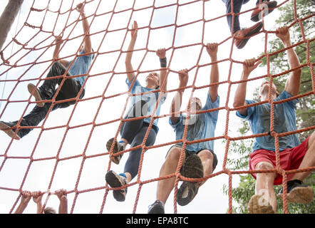 team climbing net boot camp obstacle course Stock Photo