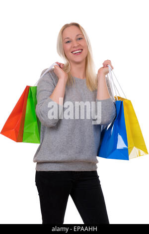 Junge Blondine beim Shopping mit Einkaufstaschen Stock Photo