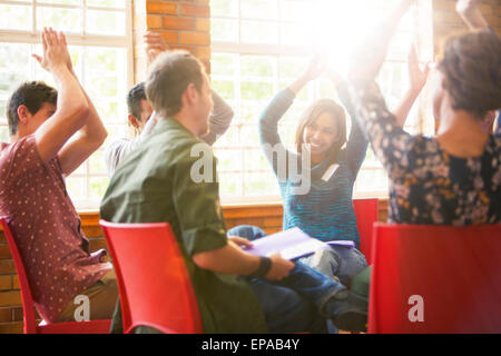 people clapping overhead group therapy Stock Photo