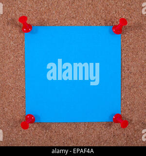 A blank piece of Note Paper pinned to a noticeboard. Stock Photo