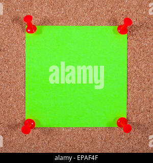 Blank Note Paper Pinned to a Noticeboard. Stock Photo