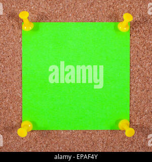 Blank Note Paper Pinned to a Noticeboard. Stock Photo
