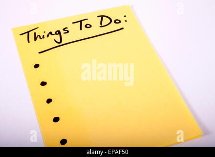 Things to Do written on a piece of Note Paper. Stock Photo