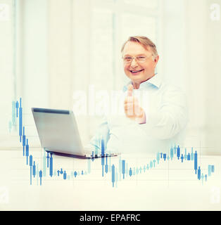 old man with laptop computer showing thumbs up Stock Photo