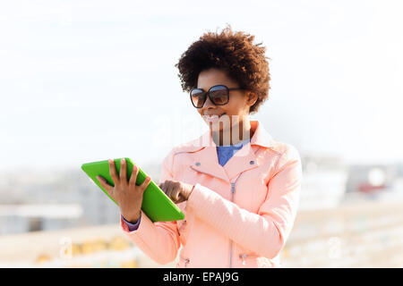 happy young woman or teenage girl with tablet pc Stock Photo