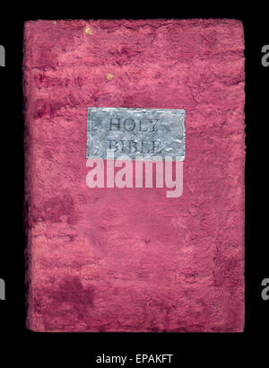 Holy Bible in a soft velvet cover isolated on black background Stock Photo