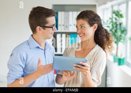 Business people communicating over digital tablet Stock Photo