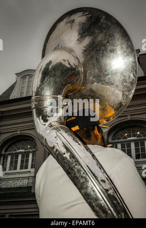 Street musician entertains tourists in Jackson Square with his Tuba in the French Quarter of New Orleans, LA Stock Photo