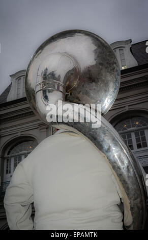 Street musician entertains tourists in Jackson Square with his Tuba in the French Quarter of New Orleans, LA Stock Photo