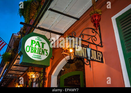 Overhead signs outside the famous, Pat O'Brien's Tavern at dusk, famous for their legendary cocktail, the 'Hurricane', French Quarter, New Orleans, LA Stock Photo