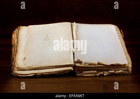 Open old book with blank pages for text on vintage wooden table Stock Photo