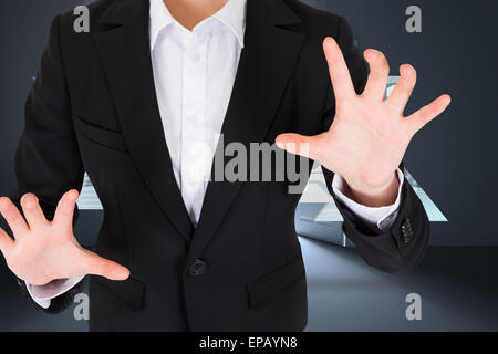 Composite image of businesswoman presenting Stock Photo