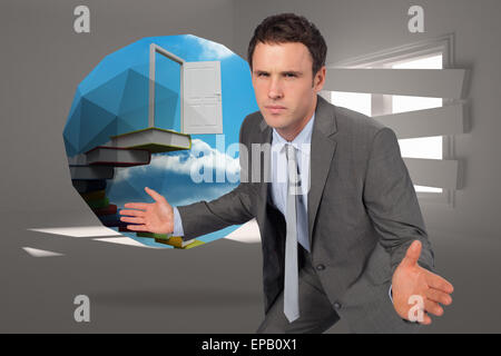 Composite image of businessman posing with hands out Stock Photo