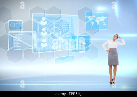 Composite image of smiling thoughtful businesswoman Stock Photo