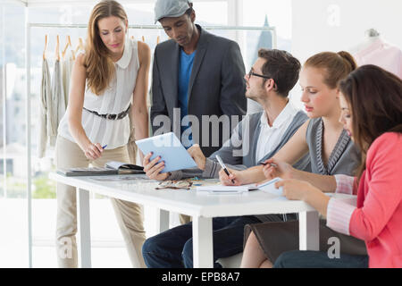 Fashion designers discussing designs Stock Photo