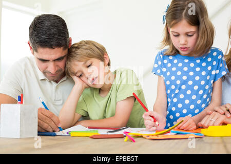Father and children coloring Stock Photo
