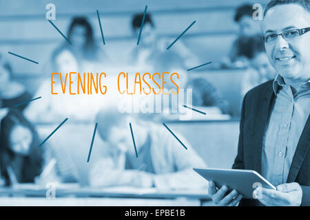 Evening classes against lecturer standing in front of his class in lecture hall Stock Photo