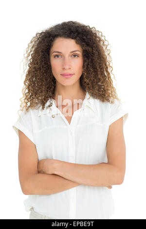 Serious woman looking at camera with arms crossed Stock Photo