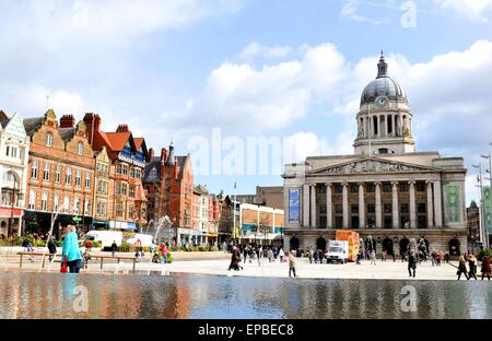 NOTTINGHAM, UK - APRIL 1, 2015: The iconic building of the Nottingham Council House overlooks the populated Old Market Square Stock Photo