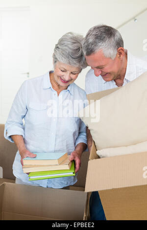Happy senior couple moving into new home Stock Photo