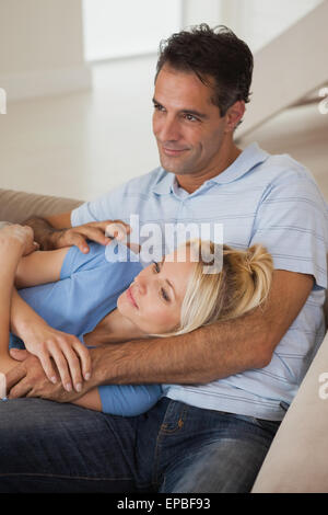Relaxed loving couple looking away Stock Photo