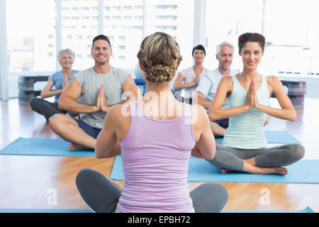 Sporty people with joined hands Stock Photo