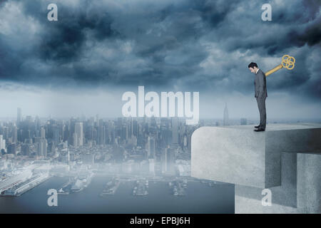 Composite image of wound up businessman with hands in pockets Stock Photo