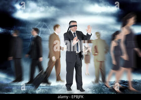 Composite image of mature businessman in a blindfold Stock Photo