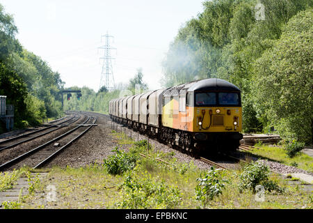 A Colas Rail class 56 diesel locomotive hauling a freight train at Water Orton, Warwickshire, UK Stock Photo