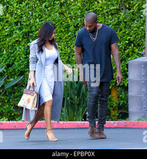 Kanye West  and Kim Kardashian, who's holding an original Hermes bag painted by their daughter North, head to the Kardashians' office in Los Angeles  Featuring: Kanye West, Kim Kardashian Where: Los Angeles, California, United States When: 10 Nov 2014 Credit: WENN.com Stock Photo