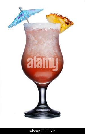 Alcoholic cocktail in hurricane glass decorated with umbrella and pineapple slice. Fresh, clean look. Stock Photo