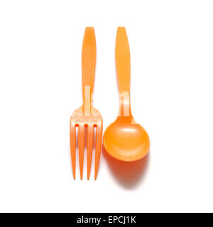 orange plastic spoon and fork on a white background Stock Photo