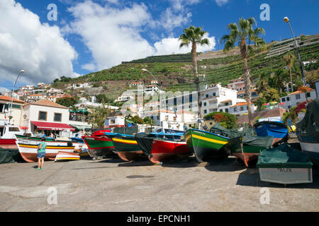 Fishing boats moored on the beach in the harbour of Camara de Lobos on the Portuguese island of Madeira Stock Photo