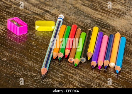 Sort crayons flooring surfaces, bright colors, red, yellow, black ...