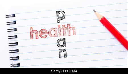 HEALTH PLAN crossword written on notebook page, red pencil on the right. Motivational Concept image Stock Photo