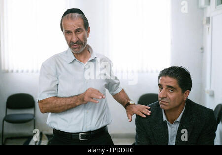 Gett: The Trial of Viviane Amsalem is a 2014 Israeli-French drama film directed by Ronit Elkabetz and Shlomi Elkabetz.   This photograph is for editorial use only and is the copyright of the film company and/or the photographer assigned by the film or production company and can only be reproduced by publications in conjunction with the promotion of the above Film. A Mandatory Credit to the film company is required. The Photographer should also be credited when known. Stock Photo