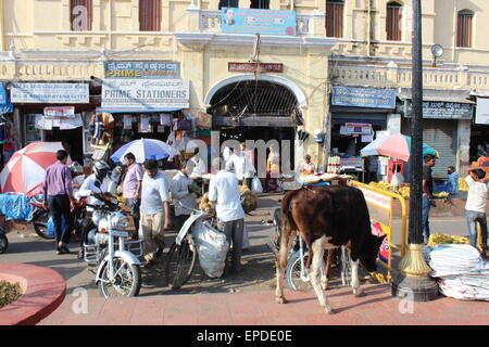 The streets and markets of central Mysore: a busy scene in front of Devaraja Market Stock Photo